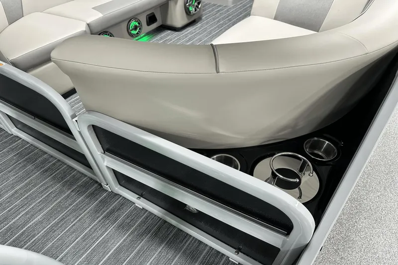 Slide: The Image of 2024 Premier 250 Solaris Sport boat interior with cup holders and cushioned seating. - 36