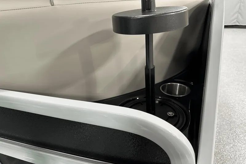 Slide: The Image of 2024 Premier 250 Solaris Sport boat interior with cup holder and seating detail. - 39