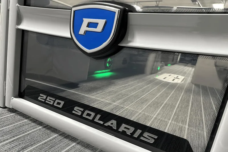 Slide: The Image of 2024 Premier 250 Solaris Sport boat interior with logo and sleek design. - 4