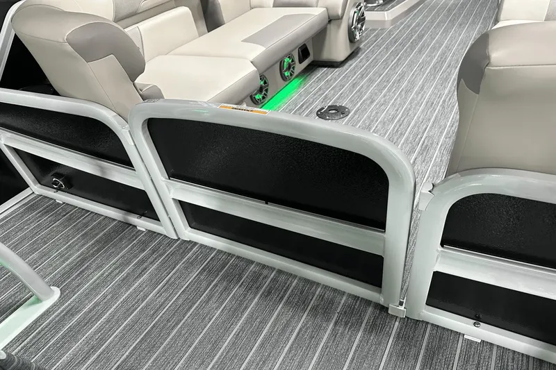 Slide: The Image of 2024 Premier 250 Solaris Sport interior with gray seating and striped flooring. - 40