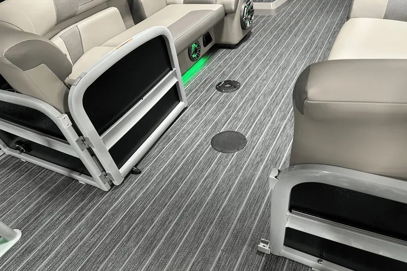 Slide: The Image of 2024 Premier 250 Solaris Sport interior with gray seating and striped flooring. - 41