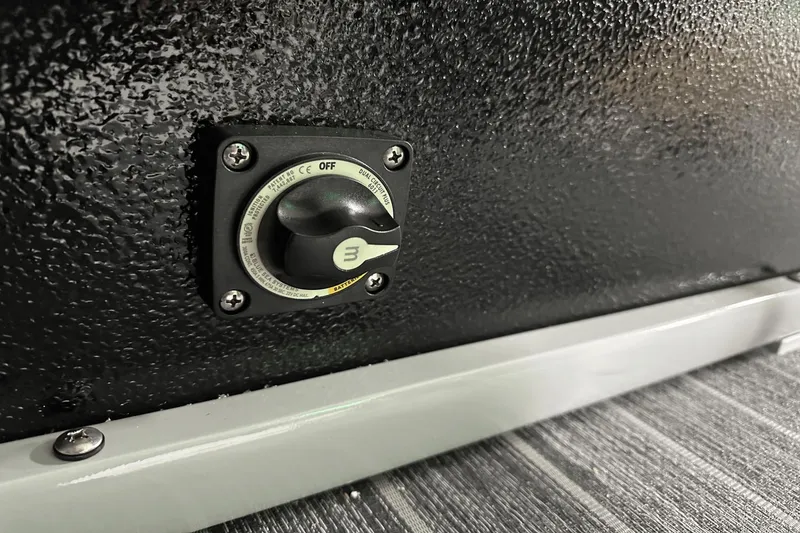 Slide: The Image of 2024 Premier 250 Solaris Sport battery switch on textured black surface. - 43