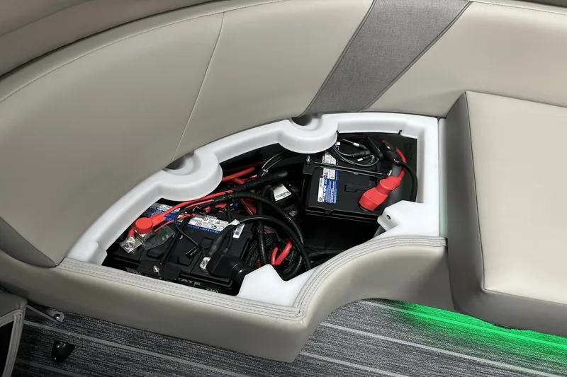 Slide: The Image of 2024 Premier 250 Solaris Sport battery compartment with wiring and storage. - 47