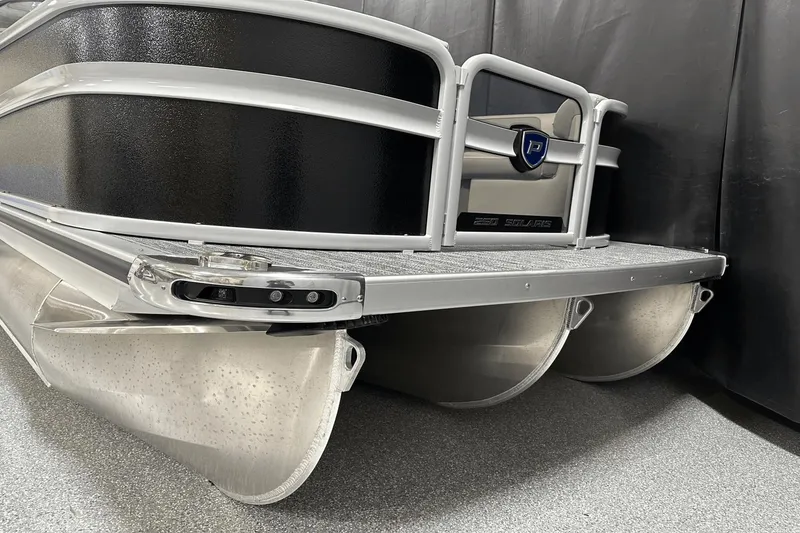 Slide: The Image of 2024 Premier 250 Solaris Sport pontoon boat, sleek design, close-up view. - 5