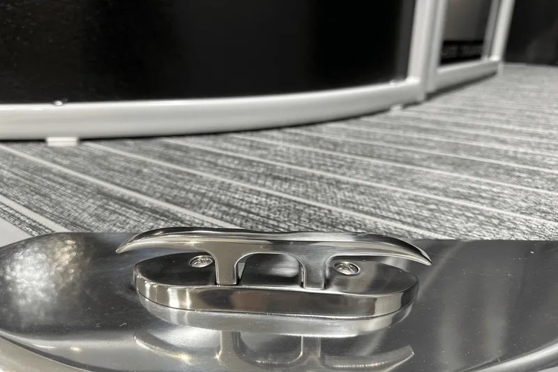 Slide: The Image of Close-up of 2024 Premier 250 Solaris Sport boat cleat on striped deck. - 7