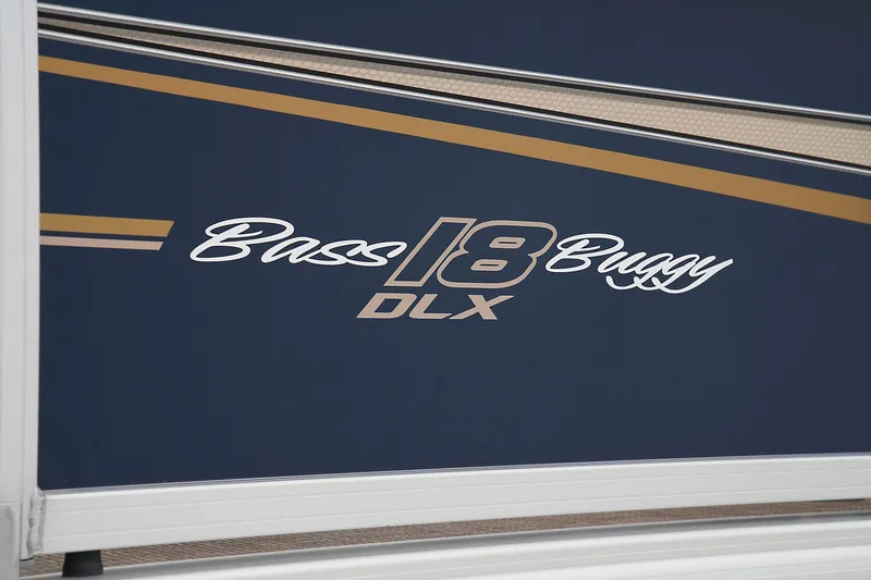 Slide: The Image of 2024 Sun Tracker Bass Buggy 18 DLX logo on boat exterior. - 20