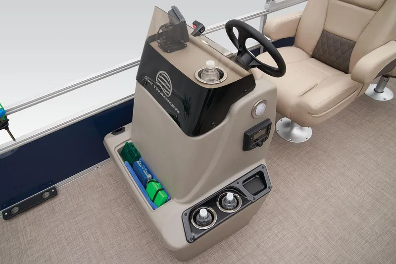 Slide: The Image of 2024 Sun Tracker Bass Buggy 18 DLX console with steering wheel and storage compartments. - 29