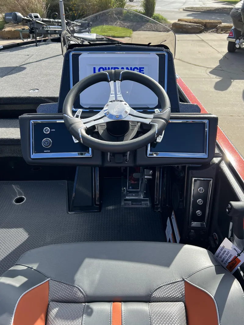 Slide: The Image of 2024 Ranger Z521R Ranger Cup Equipped boat dashboard with steering wheel and Lowrance electronics. - 5