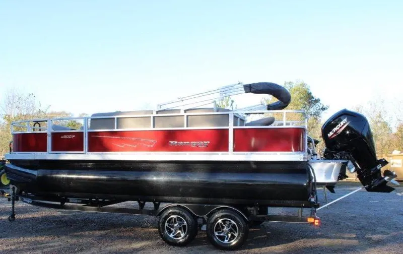 The Image of 2024 Ranger Reata 200F pontoon boat on trailer, red and black color scheme. - 0