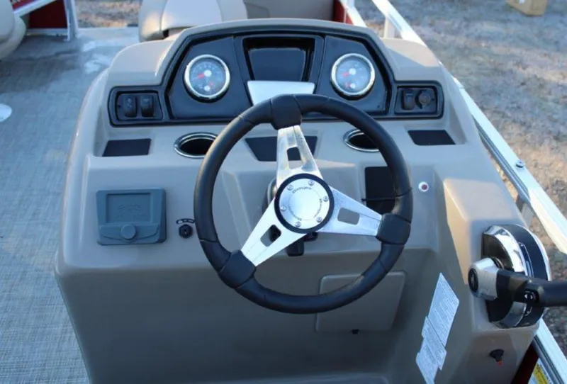 Slide: The Image of 2024 Ranger Reata 200F boat dashboard with steering wheel and instrument panel. - 4