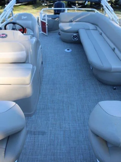 Slide: The Image of 2024 Ranger Reata 200F boat interior with beige seating and gray flooring. - 6