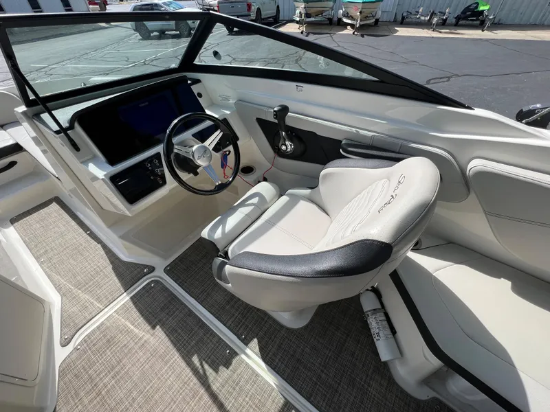 Slide: The Image of 2021 Sea Ray SPO 210 boat interior with steering wheel and captain's seat. - 3
