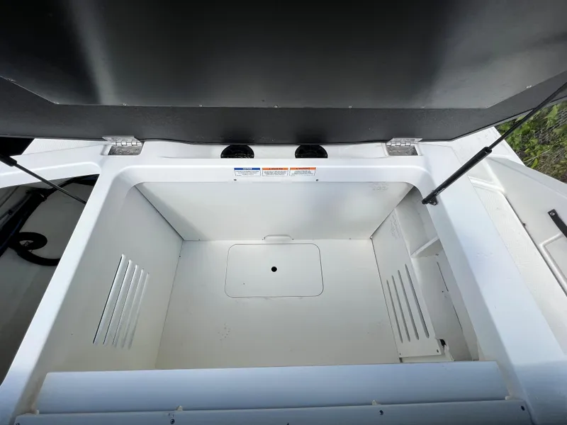 Slide: The Image of Open storage compartment in 2021 Sea Ray SPO 210 boat. - 7