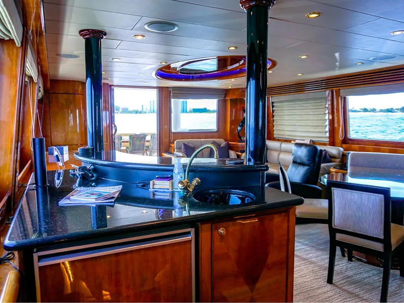 Slide: The Image of Luxurious interior of 2003 Hargrave Sky Lounge Motoryacht with elegant wood finishes and seating. - 11