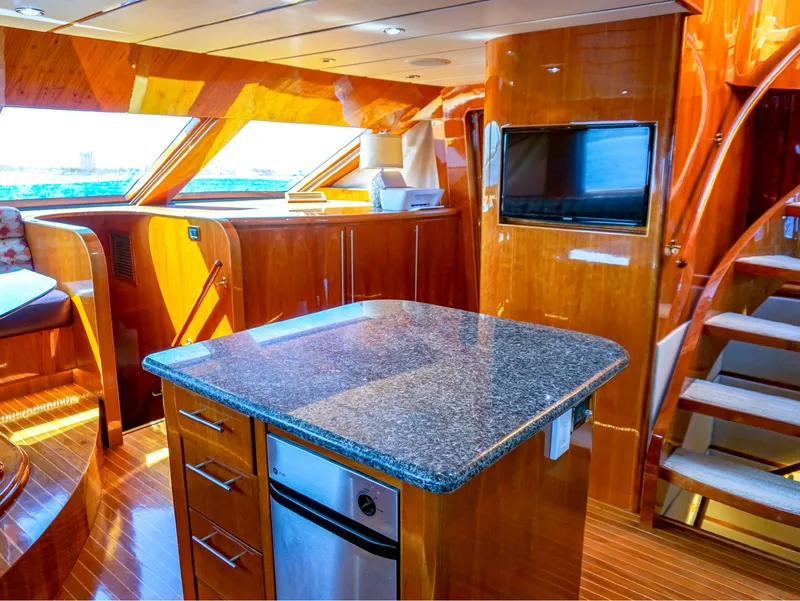 Slide: The Image of Luxurious interior of 2003 Hargrave Sky Lounge Motoryacht with modern kitchen and wood finishes. - 13