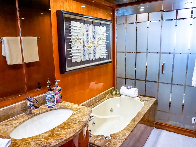 Slide: The Image of Luxurious bathroom in 2003 Hargrave Sky Lounge Motoryacht with marble sink and bathtub. - 19