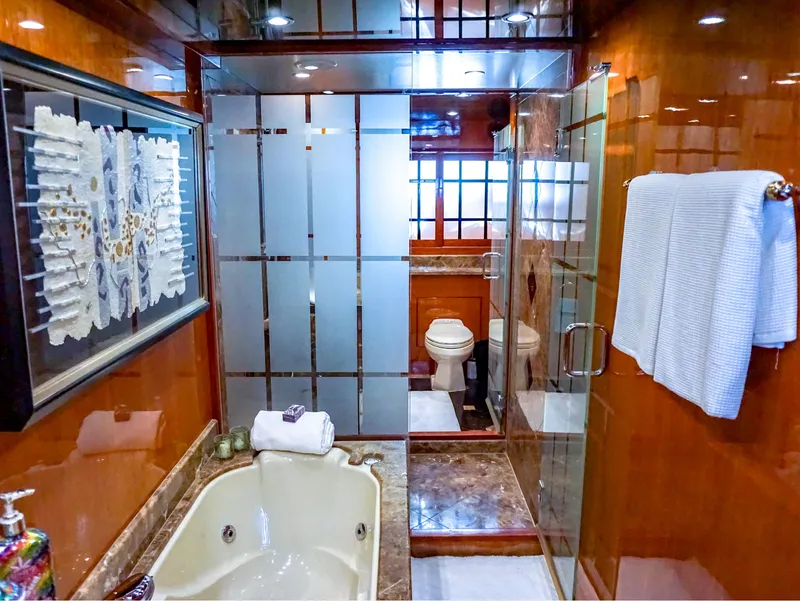 Slide: The Image of Luxurious bathroom in 2003 Hargrave Sky Lounge Motoryacht with tub, shower, and elegant decor. - 20