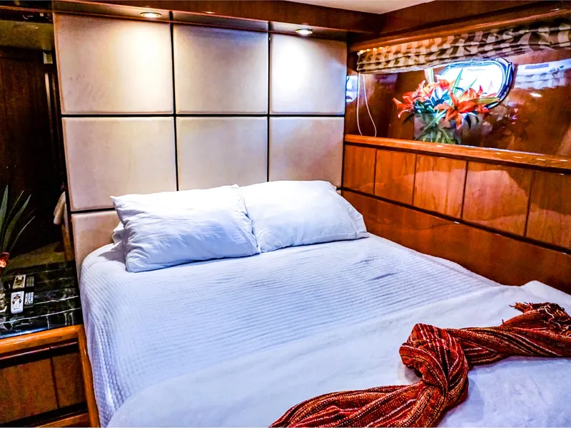 Slide: The Image of Luxurious bedroom in 2003 Hargrave Sky Lounge Motoryacht with elegant wood paneling and cozy bedding. - 21