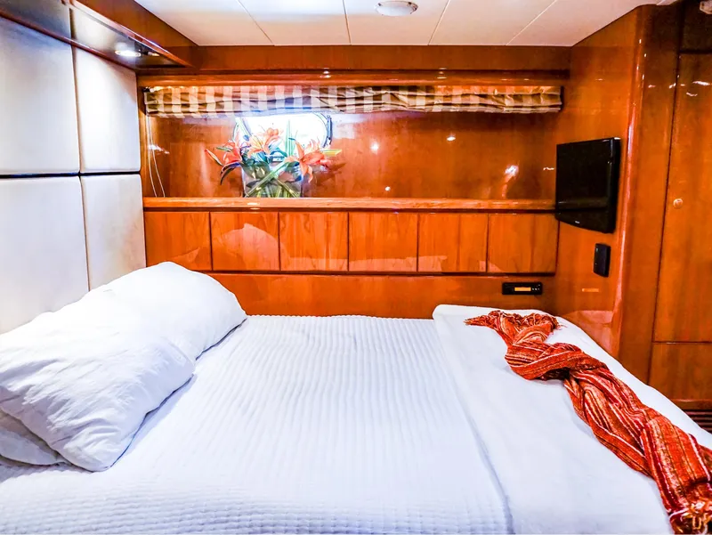Slide: The Image of Luxurious bedroom in 2003 Hargrave Sky Lounge Motoryacht with wood paneling and cozy bedding. - 22