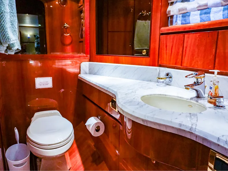 Slide: The Image of Luxurious bathroom in 2003 Hargrave Sky Lounge Motoryacht with marble countertop and wooden cabinetry. - 23
