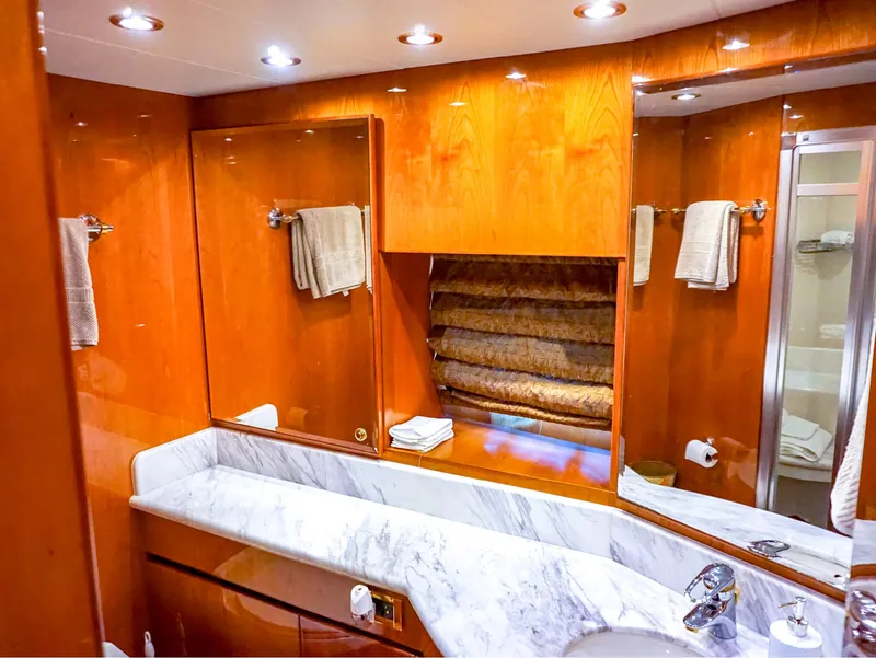 Slide: The Image of Luxurious bathroom in 2003 Hargrave Sky Lounge Motoryacht with marble countertop and wood accents. - 28