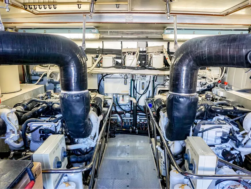 Slide: The Image of Engine room of 2003 Hargrave Sky Lounge Motoryacht with dual engines and complex piping. - 29