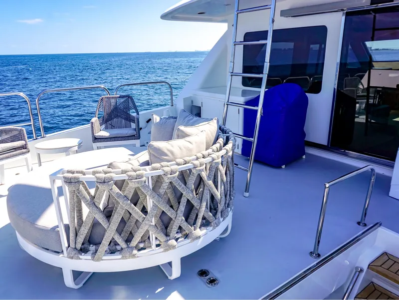 Slide: The Image of Luxurious 2003 Hargrave Sky Lounge Motoryacht deck with ocean view and stylish seating. - 3
