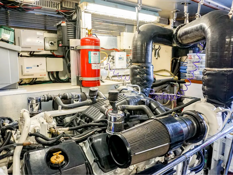 Slide: The Image of Engine room of 2003 Hargrave Sky Lounge Motoryacht with visible machinery and fire extinguisher. - 30