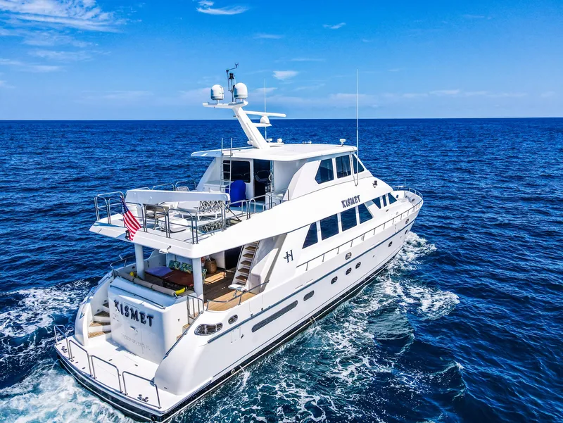 Slide: The Image of 2003 Hargrave Sky Lounge Motoryacht cruising on open sea under clear blue sky. - 34