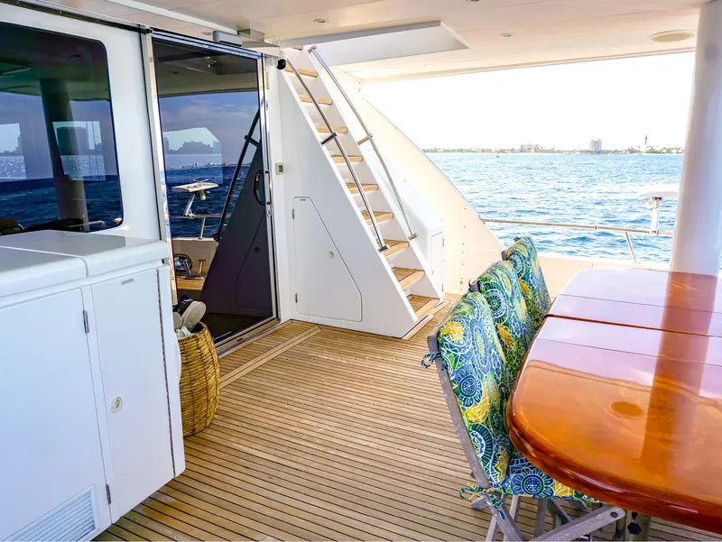 Slide: The Image of Luxurious 2003 Hargrave Sky Lounge Motoryacht deck with ocean view and elegant seating. - 4