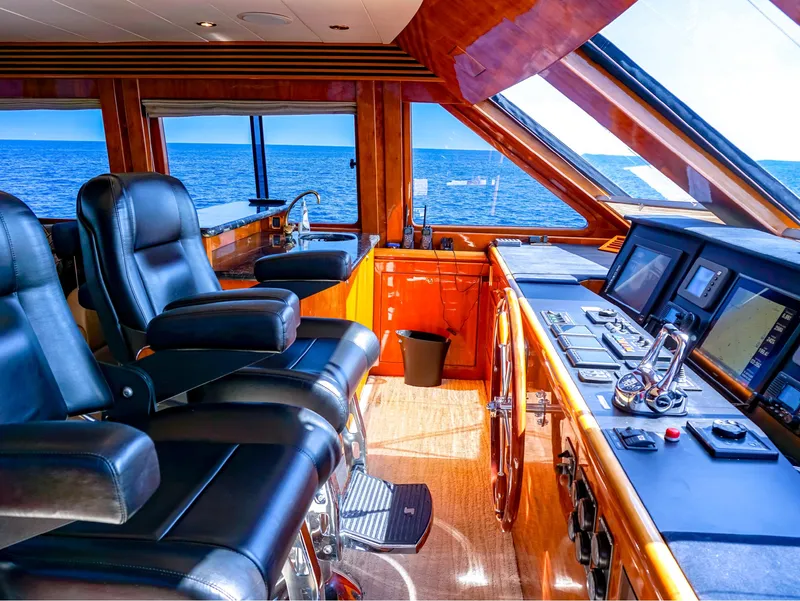 Slide: The Image of Luxurious 2003 Hargrave Sky Lounge Motoryacht interior with ocean view and modern controls. - 6
