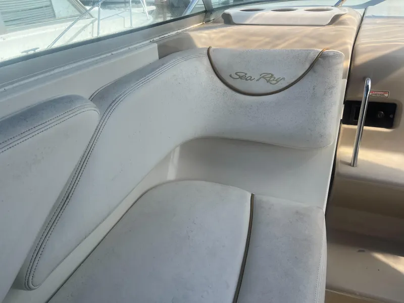 Slide: The Image of 2002 Sea Ray 260 Sundancer interior seating with embroidered logo. - 10