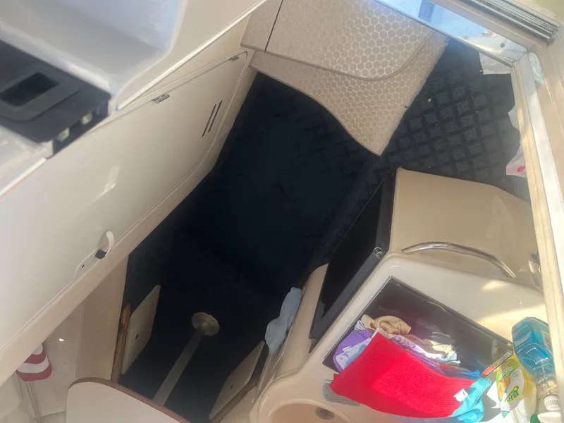 Slide: The Image of Interior view of 2002 Sea Ray 260 Sundancer cabin with seating and storage. - 11