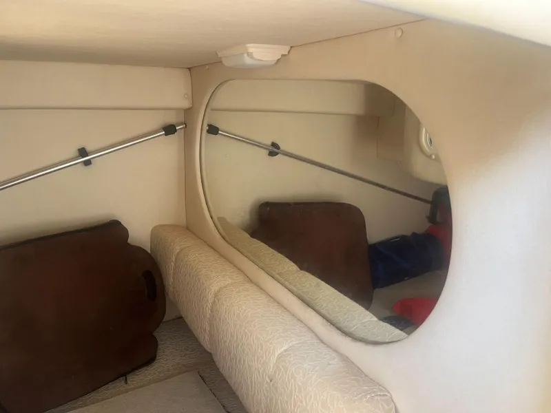 Slide: The Image of Interior cabin of 2002 Sea Ray 260 Sundancer with mirror and seating. - 12