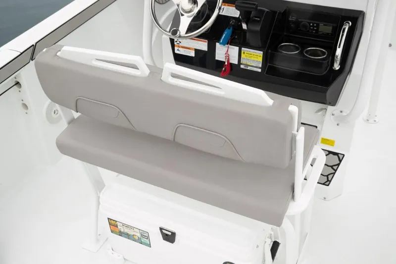 Slide: The Image of 2024 Wellcraft 202 Fisherman boat interior with helm and seating. - 20