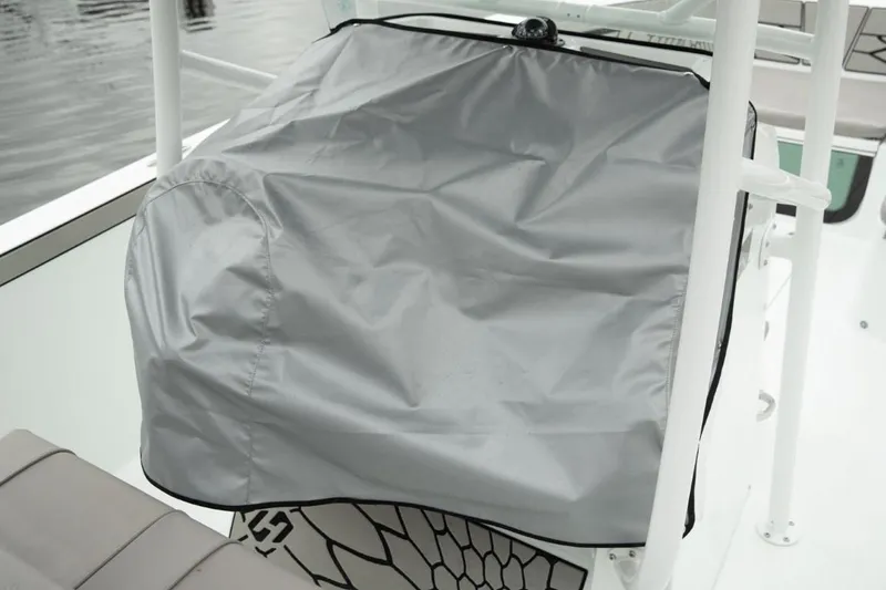Slide: The Image of 2024 Wellcraft 202 Fisherman boat console with protective cover. - 30