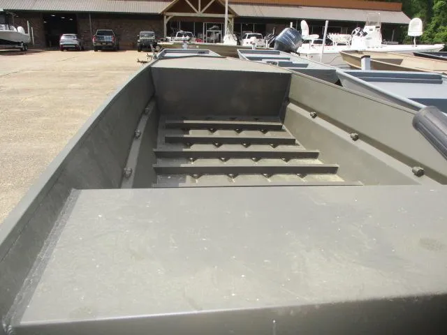 Slide: The Image of 2025 GC 1444 Jon boat interior view at dealership, showcasing spacious design. - 3