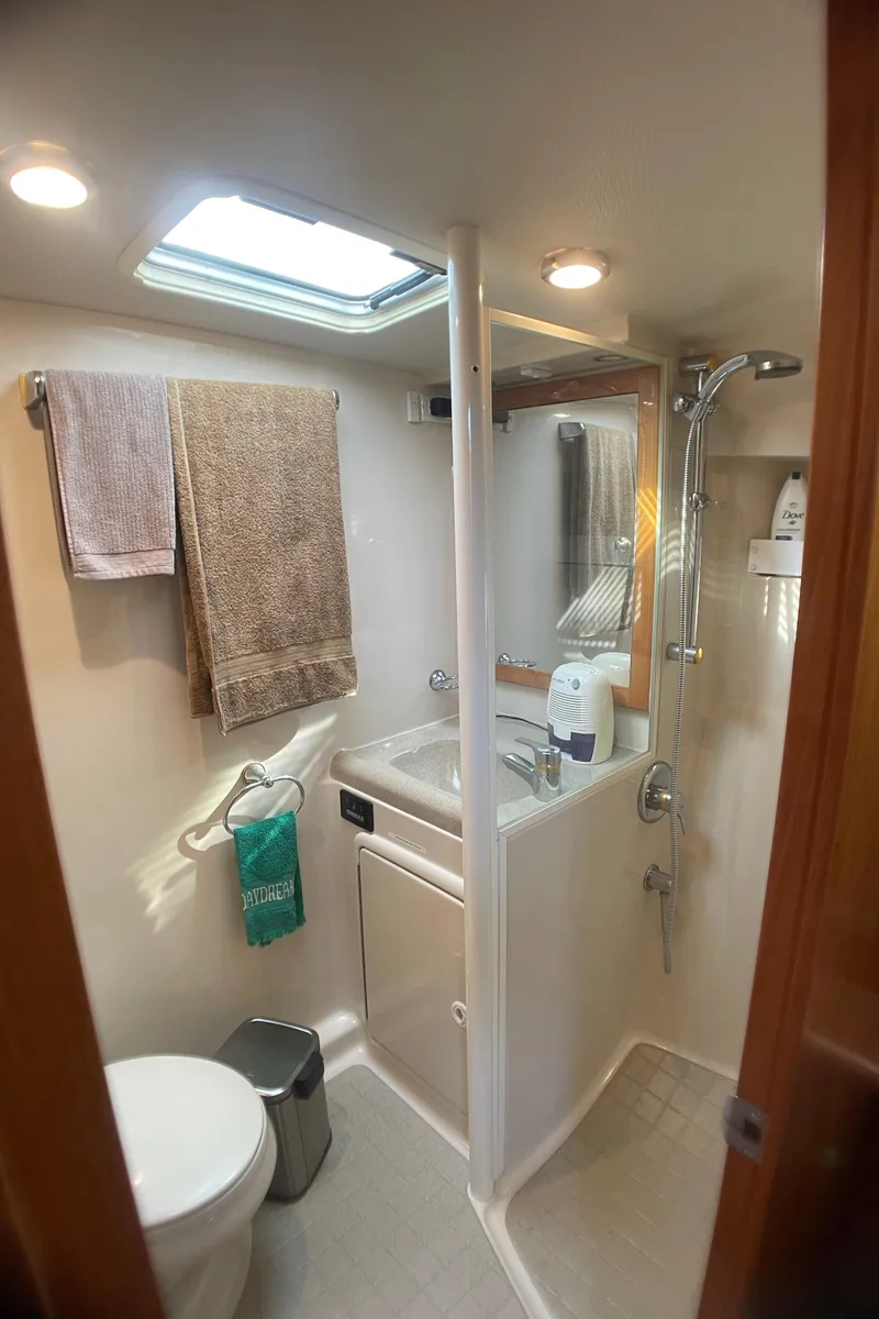 Slide: The Image of Bathroom interior of 2000 Riviera Flybridge yacht with shower and skylight. - 10