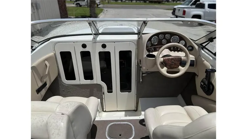 Slide: The Image of 1999 Stingray 200 CS/CX boat interior with steering wheel and dashboard. - 16