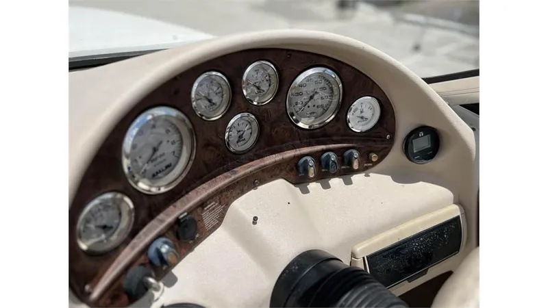 Slide: The Image of Dashboard of a 1999 Stingray 200 CS/CX boat with gauges and controls. - 7