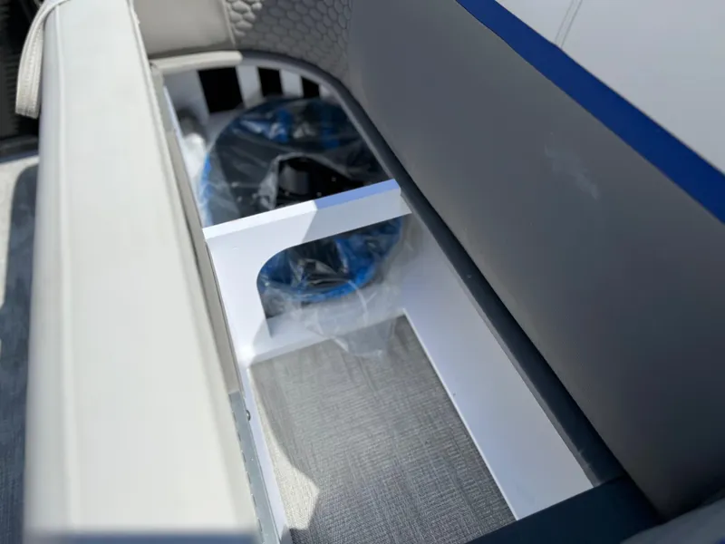 Slide: The Image of Storage compartment in 2024 Qwest RLS 818 boat. - 10