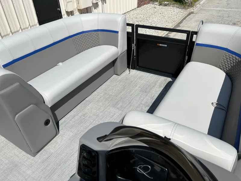 Slide: The Image of 2024 Qwest RLS 818 boat interior with gray and blue seating, modern design. - 11