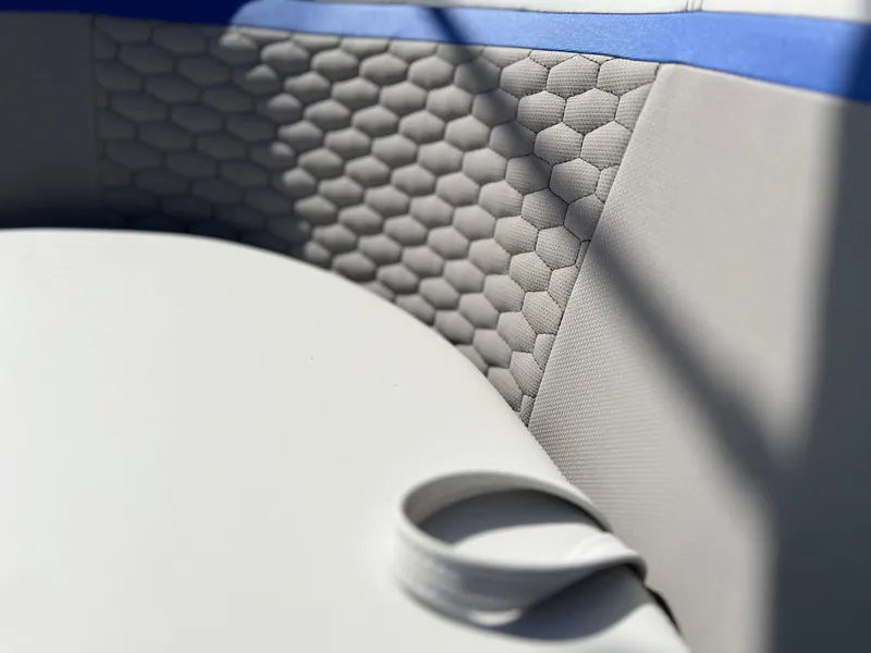 Slide: The Image of 2024 Qwest RLS 818 boat interior with hexagonal-patterned upholstery. - 14