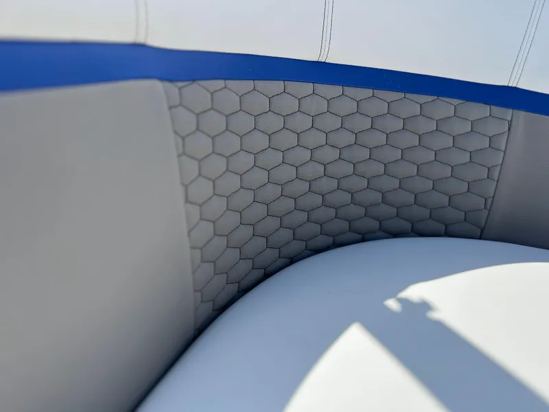 Slide: The Image of 2024 Qwest RLS 818 boat seat with hexagonal pattern upholstery. - 15