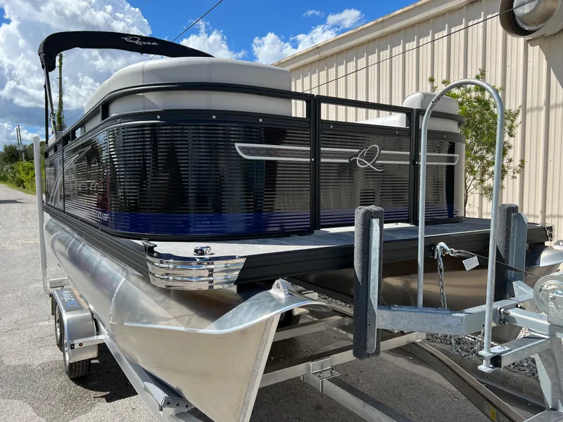 Slide: The Image of 2024 Qwest RLS 818 pontoon boat on trailer, side view, sunny day. - 20