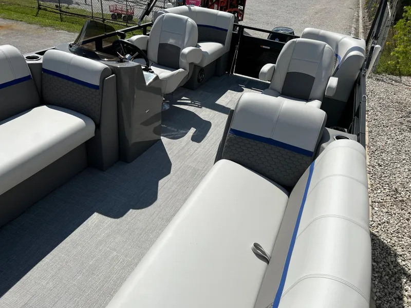 Slide: The Image of 2024 Qwest RLS 818 pontoon boat interior with gray and blue seating. - 22