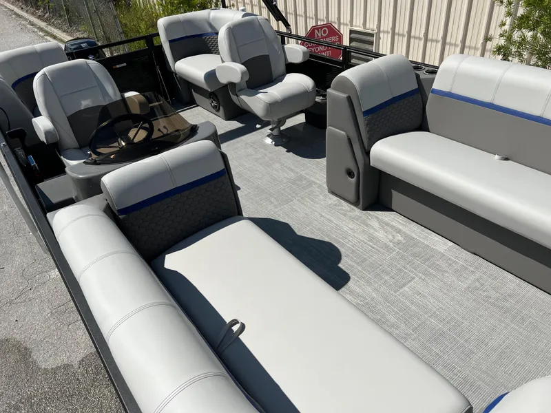 Slide: The Image of 2024 Qwest RLS 818 pontoon boat interior with gray and blue seating. - 23