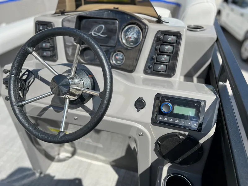 Slide: The Image of 2024 Qwest RLS 818 boat dashboard with steering wheel and control panel. - 6