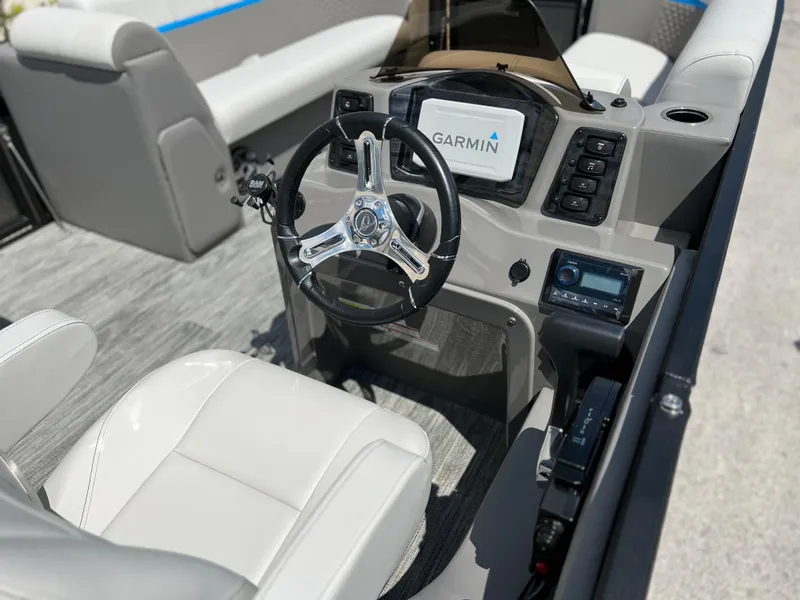 Slide: The Image of 2024 Qwest Splash Pad 822 boat cockpit with Garmin navigation system. - 15