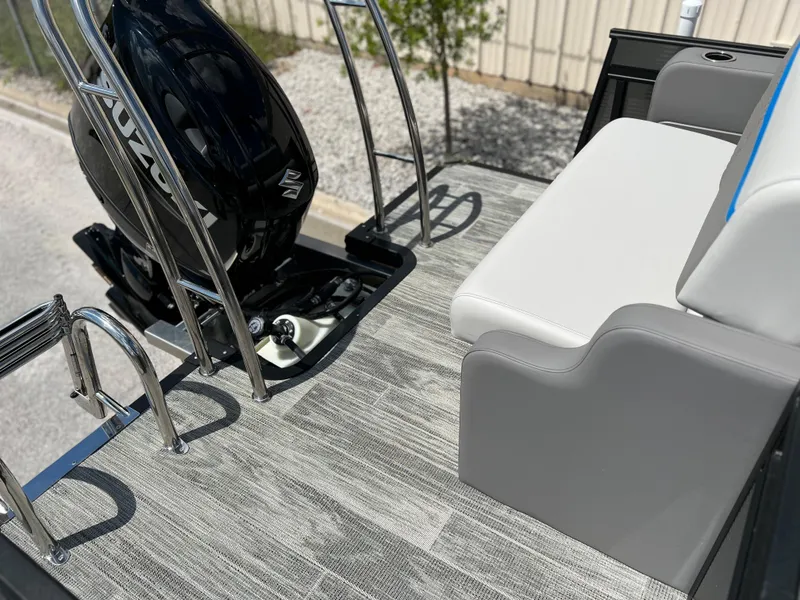 Slide: The Image of 2024 Qwest Splash Pad 822 boat deck with seating and motor. - 16